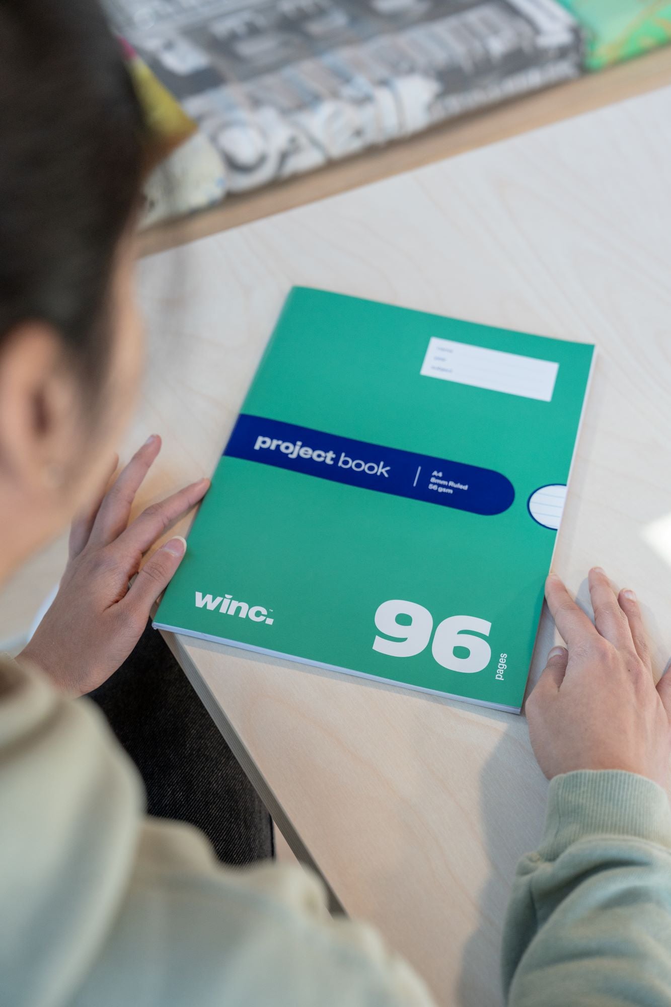 96-page project notebook with a green cover, part of the RMIT Store Laboratory Technology Kit.